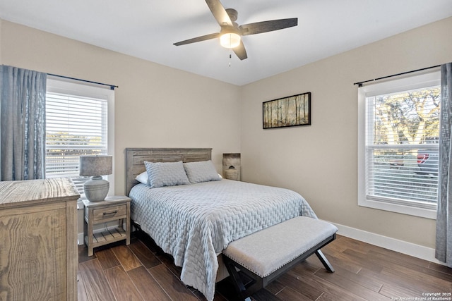 bedroom featuring dark hardwood / wood-style floors and ceiling fan