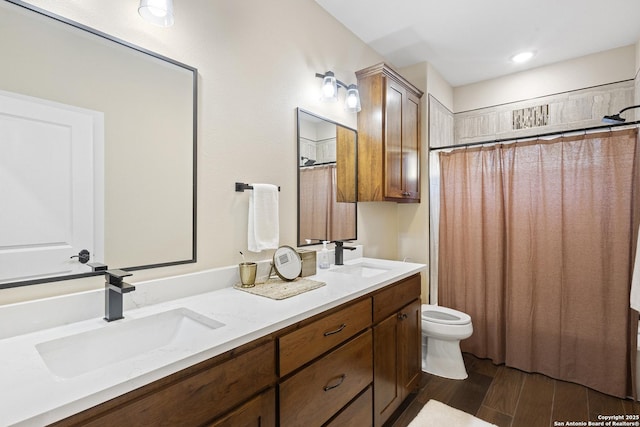 bathroom with a shower with curtain, vanity, hardwood / wood-style floors, and toilet