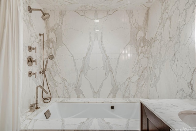 bathroom featuring vanity and shower / tub combination