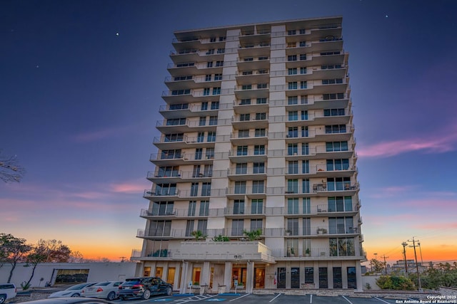 view of outdoor building at dusk