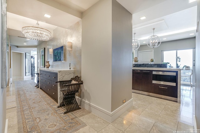 bathroom featuring vanity and an inviting chandelier