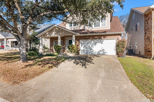 view of front facade with a garage, covered porch, and a front yard