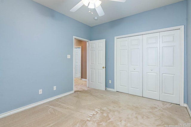 unfurnished bedroom with light carpet, a closet, and ceiling fan