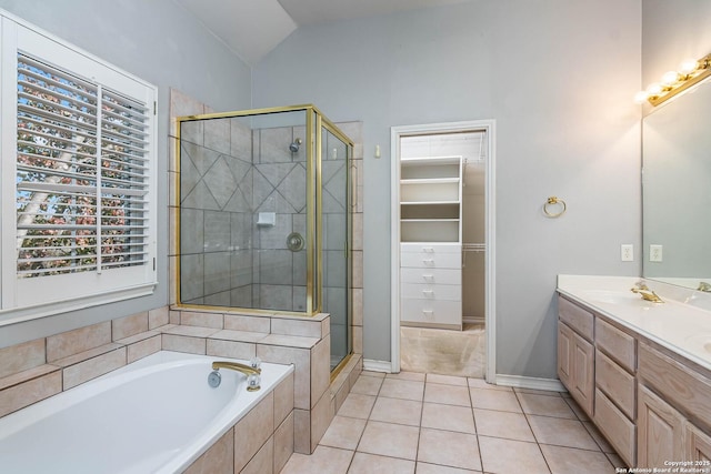 bathroom featuring tile patterned flooring, a wealth of natural light, vaulted ceiling, and shower with separate bathtub