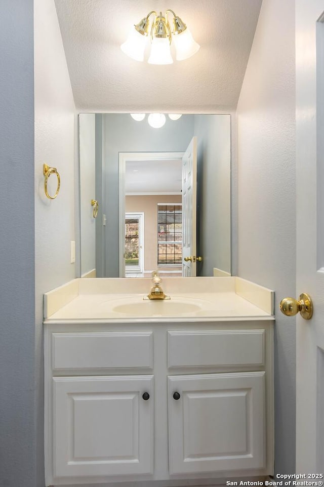 bathroom with vanity and a textured ceiling