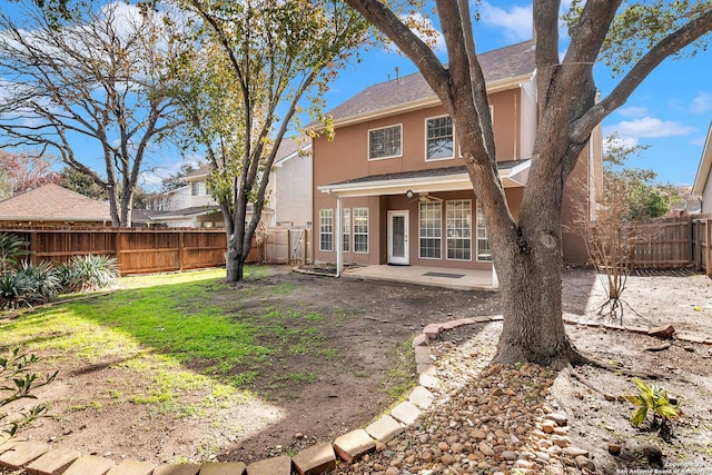 back of house featuring ceiling fan and a patio area