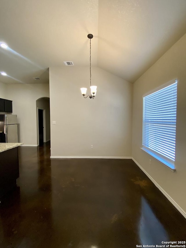 unfurnished dining area with lofted ceiling and a notable chandelier