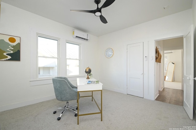 office space featuring baseboards, ceiling fan, a wall mounted AC, and light colored carpet