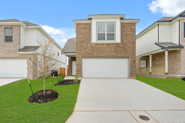 view of front property with a garage and a front yard