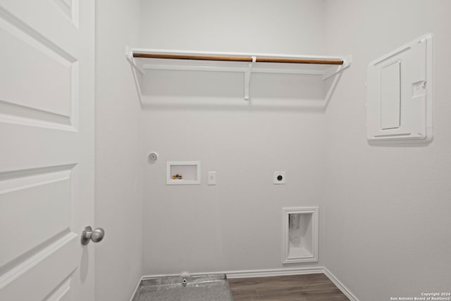 laundry area with hookup for a gas dryer, hookup for a washing machine, dark hardwood / wood-style floors, and hookup for an electric dryer