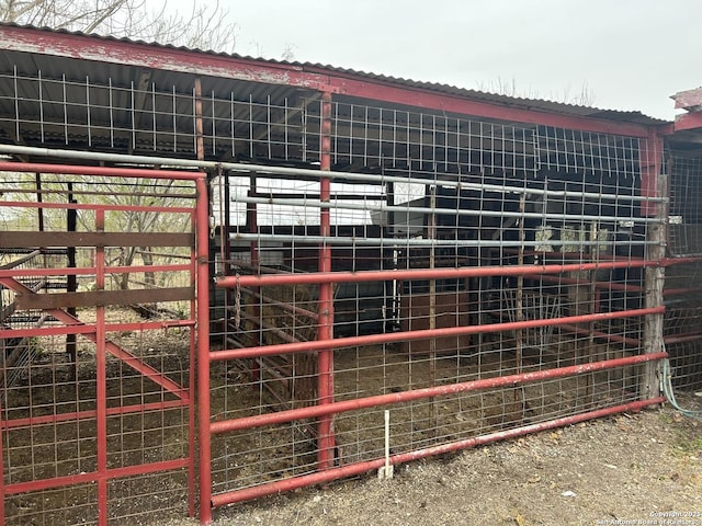 view of gate featuring an outbuilding