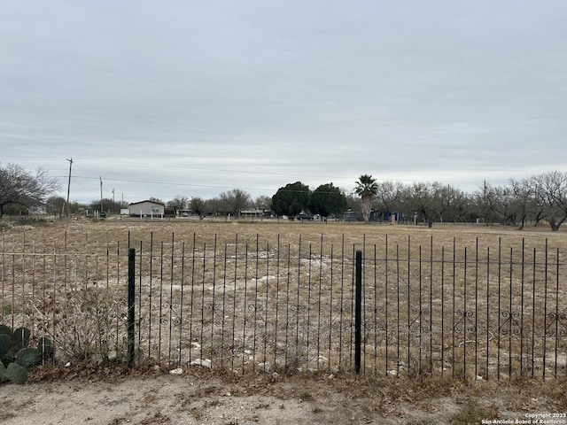 view of yard with a rural view