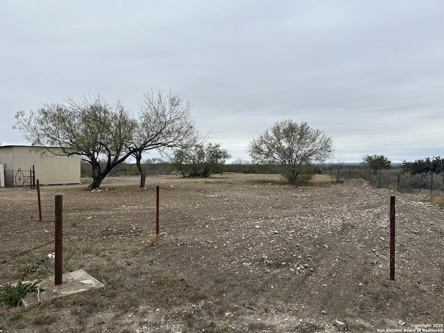 view of yard with a rural view