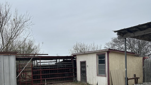 view of side of home with an outdoor structure