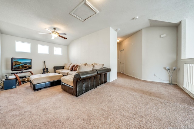 living room with lofted ceiling, light colored carpet, and ceiling fan