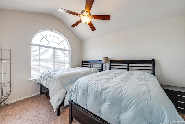 carpeted bedroom with ceiling fan and lofted ceiling