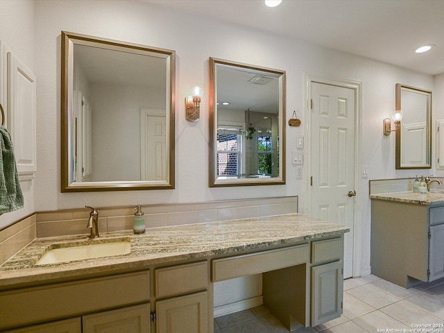 bathroom with tile patterned flooring and vanity