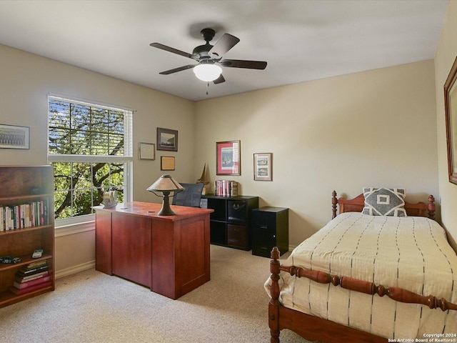 bedroom with ceiling fan and light colored carpet