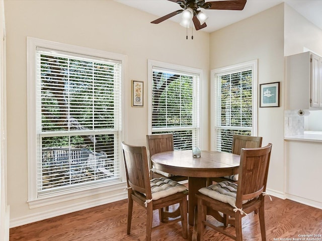 dining area with ceiling fan and wood-type flooring