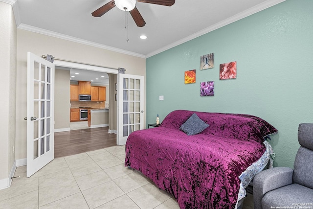 tiled bedroom with crown molding, ceiling fan, and french doors