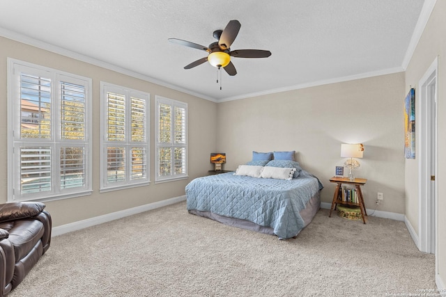 carpeted bedroom featuring crown molding, ceiling fan, and a textured ceiling