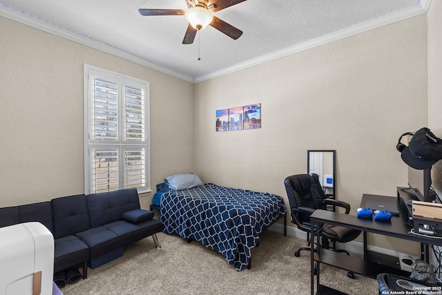 carpeted bedroom with ornamental molding, a textured ceiling, and ceiling fan