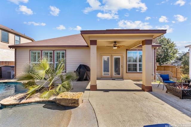 exterior space with a fenced in pool, a patio, and ceiling fan