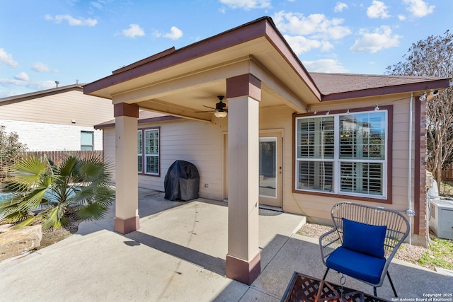 view of patio with a grill and ceiling fan