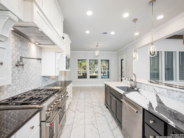 kitchen featuring white cabinetry, sink, and appliances with stainless steel finishes