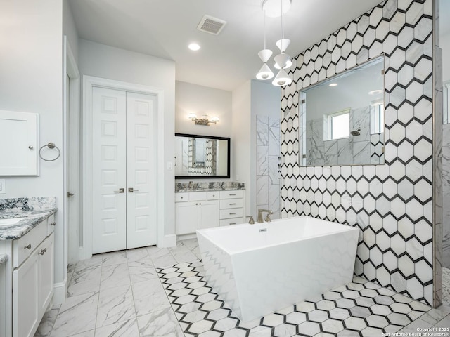 bathroom featuring vanity and separate shower and tub