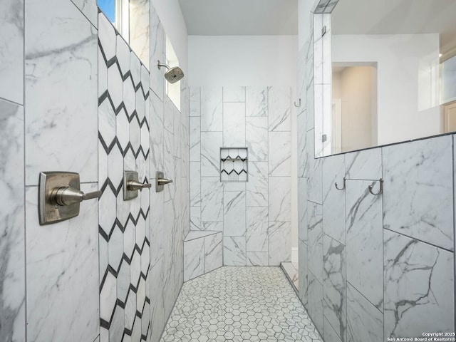 bathroom with tiled shower