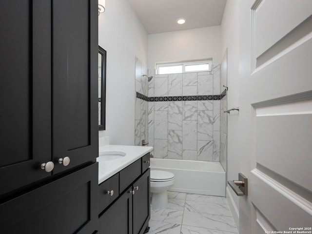 full bathroom featuring vanity, toilet, and tiled shower / bath combo