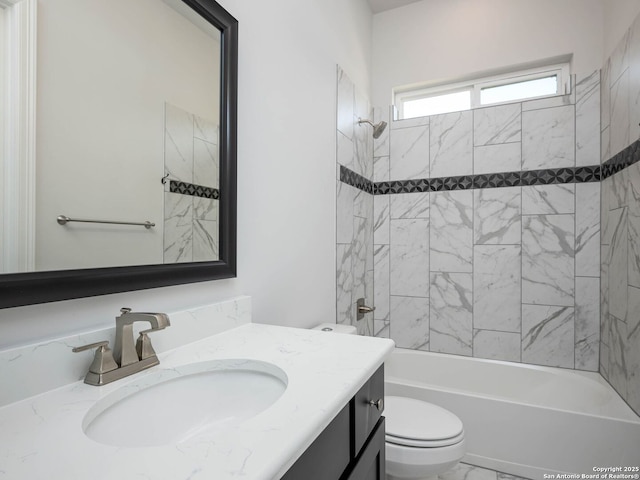 full bathroom with vanity, toilet, and tiled shower / bath combo