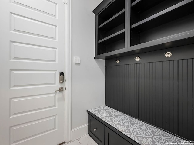 mudroom featuring light tile patterned flooring