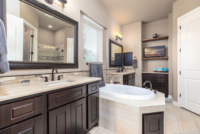 bathroom featuring vanity and separate shower and tub