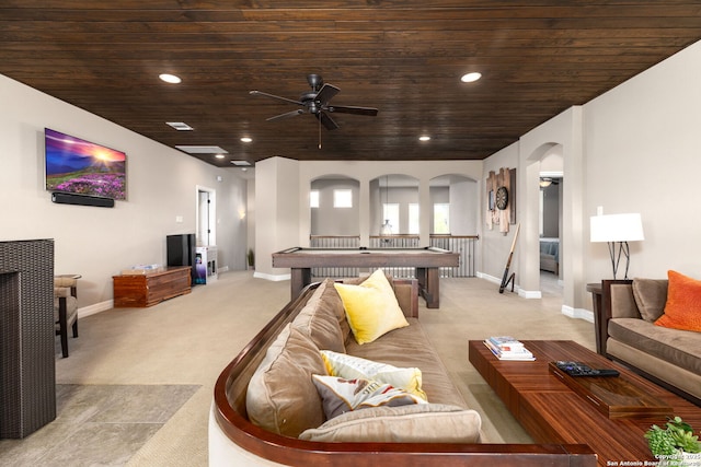 carpeted living room featuring wooden ceiling and ceiling fan