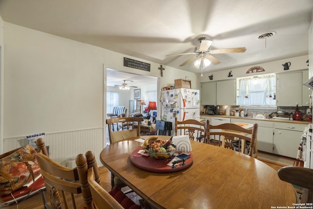 dining space featuring ceiling fan and a wealth of natural light