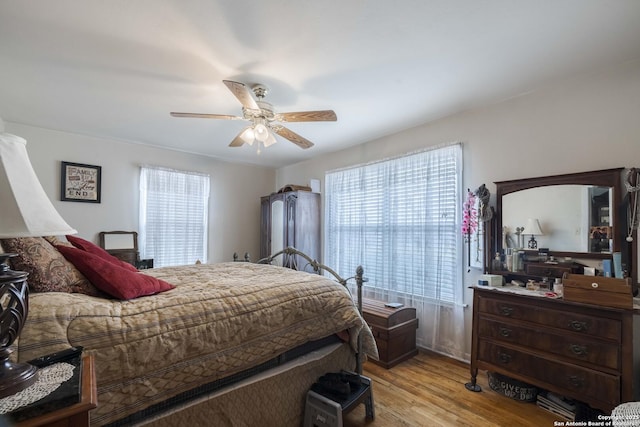 bedroom featuring ceiling fan and light hardwood / wood-style floors