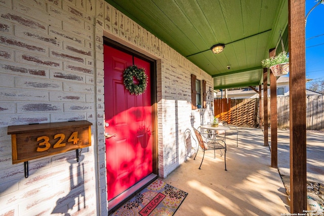 property entrance featuring covered porch