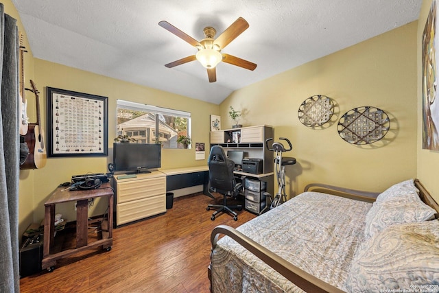 bedroom featuring a textured ceiling, vaulted ceiling, dark hardwood / wood-style floors, and ceiling fan