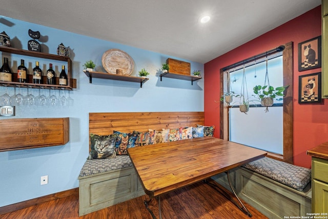 dining space with breakfast area and dark hardwood / wood-style floors