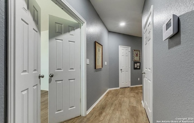 corridor featuring light hardwood / wood-style floors