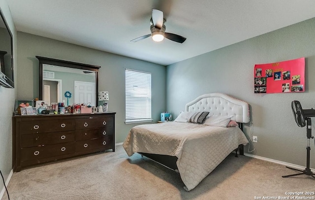 bedroom with light carpet and ceiling fan