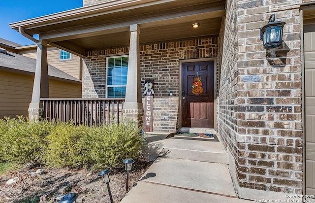 doorway to property featuring a porch