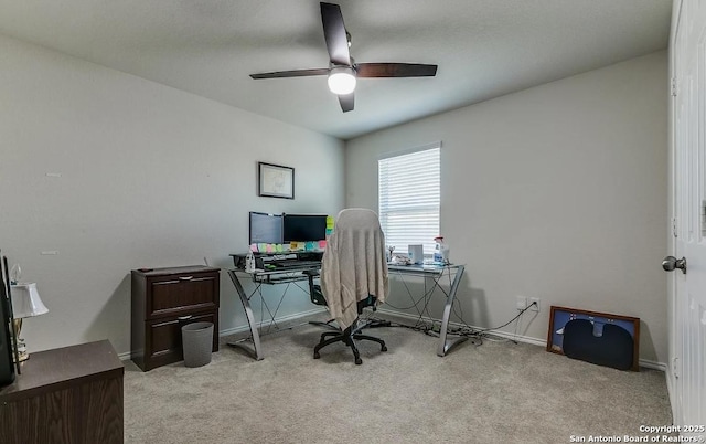 home office with light carpet and ceiling fan