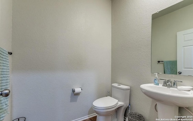 bathroom with sink and toilet