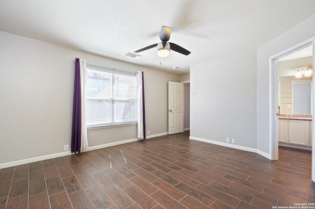 unfurnished bedroom with dark wood-style floors, visible vents, ceiling fan, and baseboards