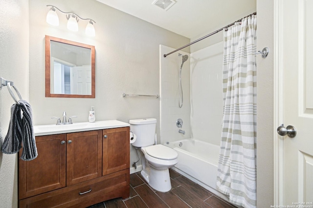 full bathroom featuring toilet, vanity, visible vents, wood tiled floor, and shower / bath combination with curtain