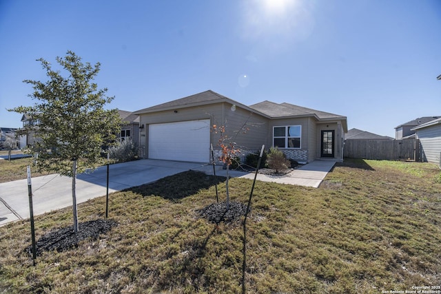 view of front facade with a garage and a front lawn