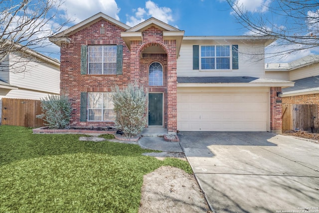 front of property featuring a garage and a front lawn